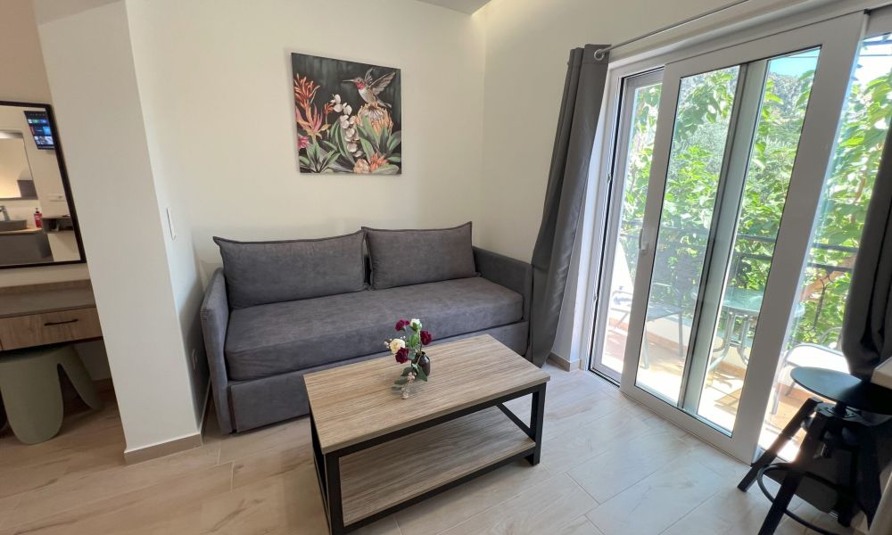 sofa and balcony aozigre hotel